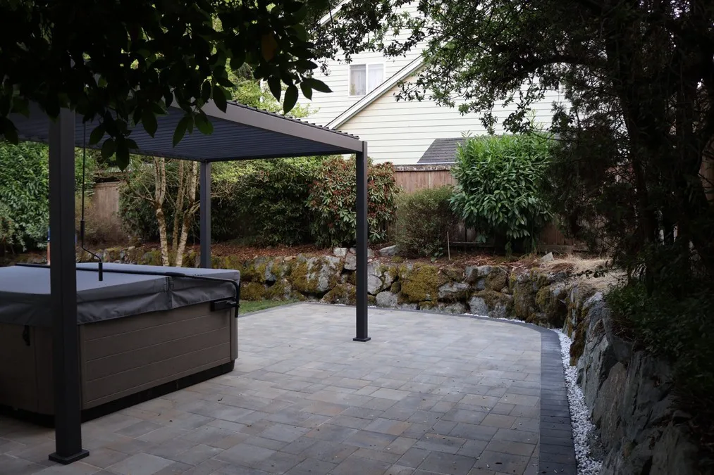 Patio, curved perimeter and the surrounding backyard