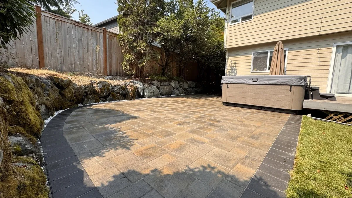 Paver surface with the transition to the lawn in view