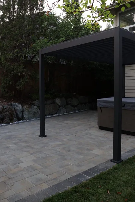 Finished patio seen beneath a pergola that is not part of this project