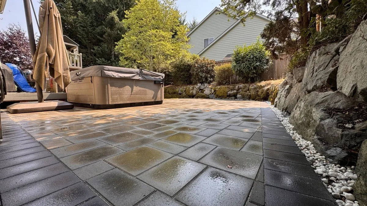 Low-angle detail of the pavers and the dark border